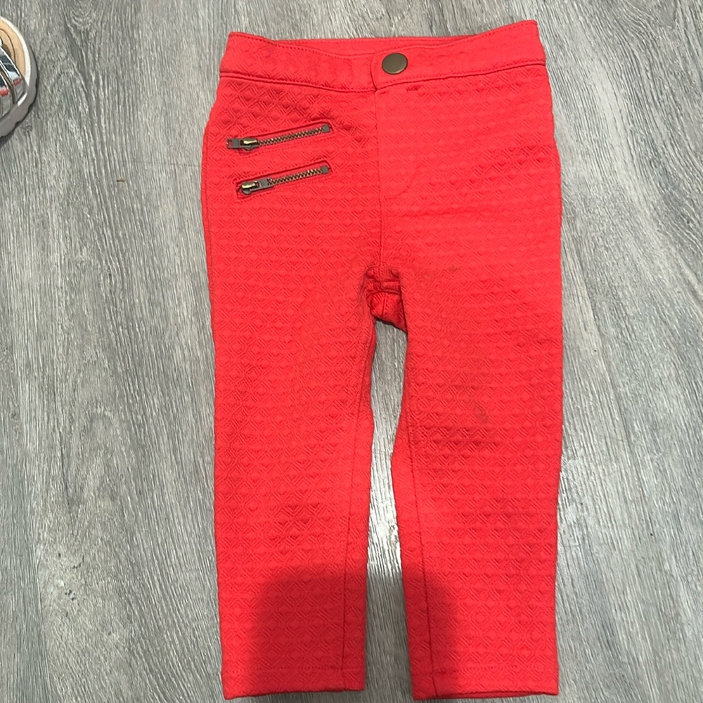 Red pull on pants with zipper detailing